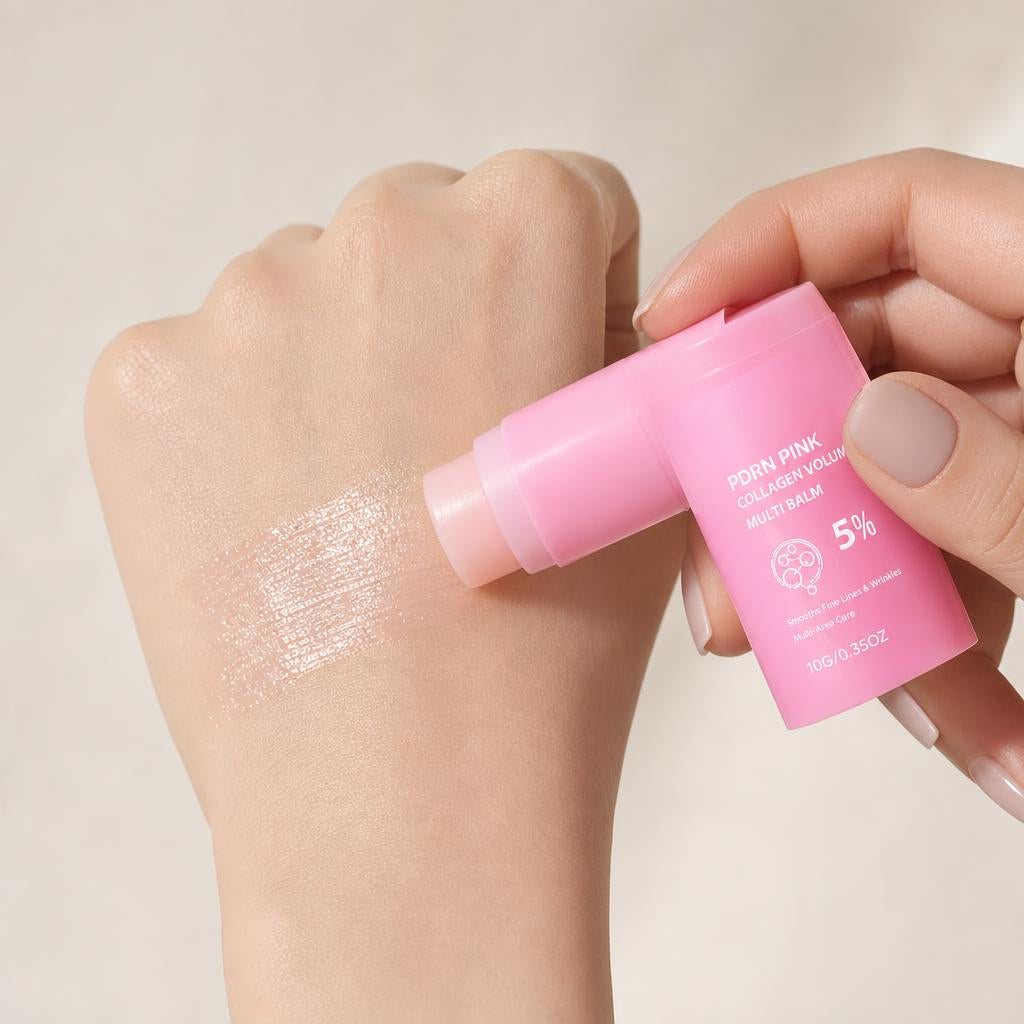 Glossy balm swatch melting on the back of a hand