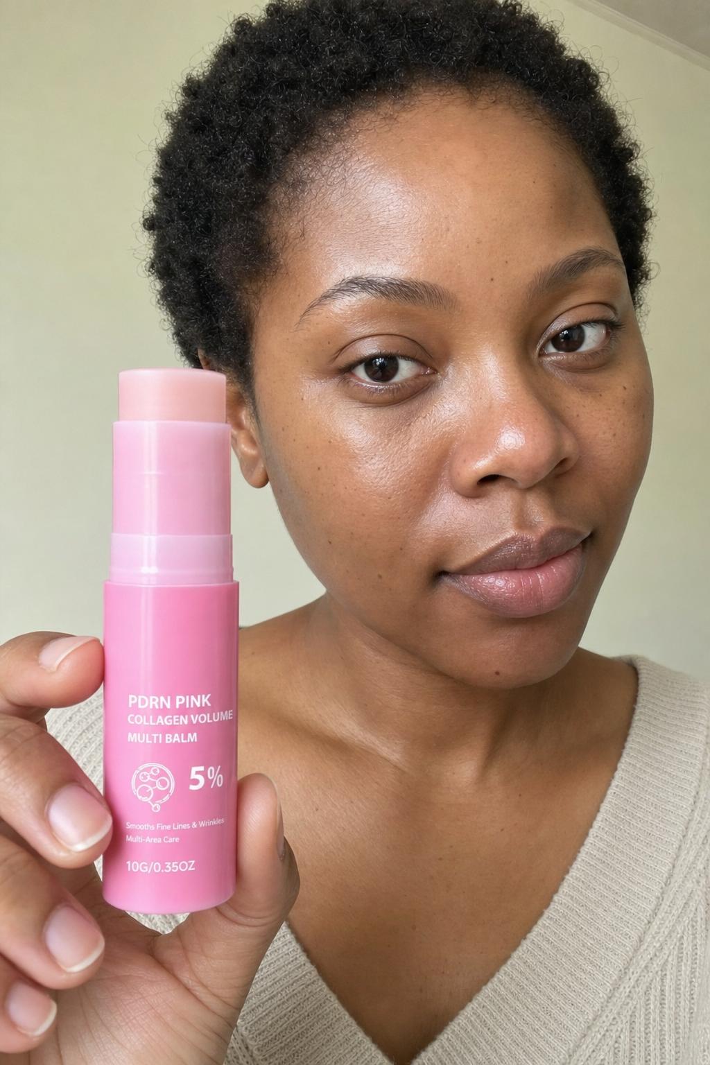 Woman gliding the balm over her cheek at home